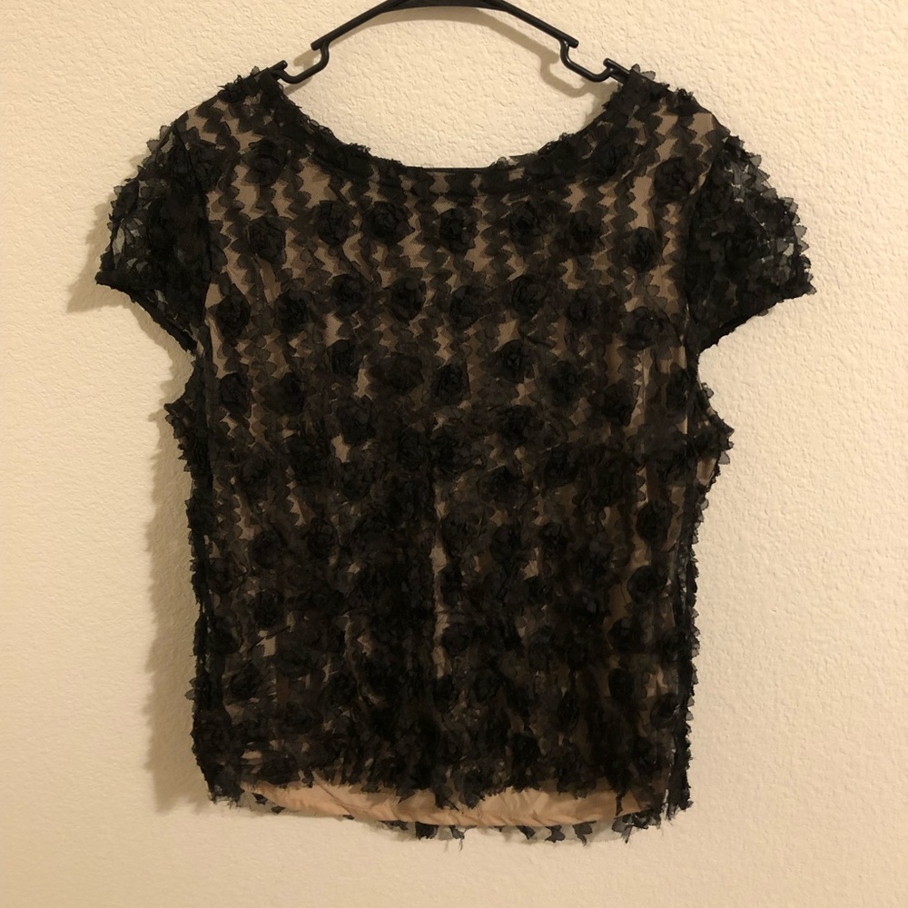 Ann Taylor elegant and fun black rosette blouse. A night out or pair with jeans.